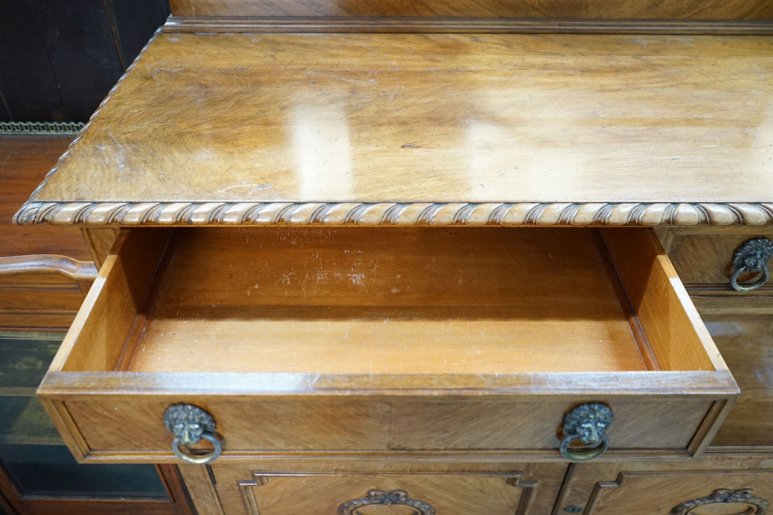 An early 20th century walnut buffet, length 144cm, depth 55cm, height 158cm